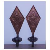Kitschy punched tin candlestick wall sconces -