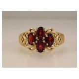 10K yellow gold ring w/ 4 large garnets, size 9