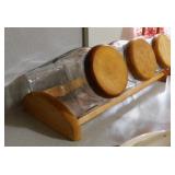 Set of 3 glass canister treat jars in wooden rack