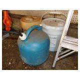 2 kerosene cans, one full - Partial bucket of