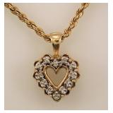 10K yellow gold: Diamond heart pendant on 18"