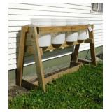 Wooden stand w/ four 5 gal. buckets, 58" x 34"