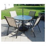 Glass top patio table & 4 metal framed chairs,