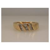 14K yellow gold ring w/ 9 channel set diamonds,
