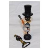 Two vintage barware bottle openers: Guitar on man