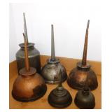 6 vintage oil cans