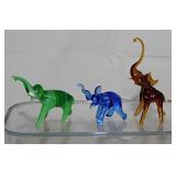 42 miniature blown glass elephants,