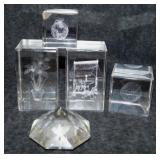 Four 3D laser etched crystal paperweights in boxes