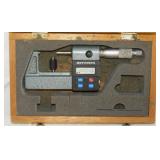 Vintage Mitutoyo digimatic micrometer in wood
