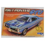 4 automobile model kits in boxes: