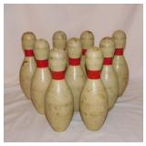 9 small wooden bowling pins, 7.5" tall