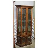 Lighted curio cabinet w/ glass shelves & mirrored