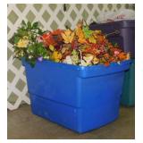 Storage tote full of faux floral dï¿½cor