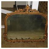 Antique mirror in gilded ornate frame, 27" x 25"