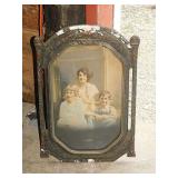 Antique colorized photo of children in carved
