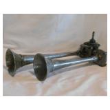 Vintage chrome-plated dual trumpet air horns,