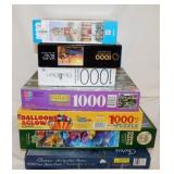 Seven 1000 piece jigsaw puzzles