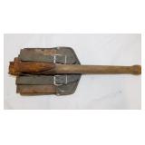 Military folding trench shovel in leather case