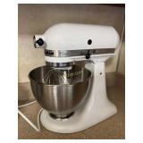 White kitchen stand mixer with cover and