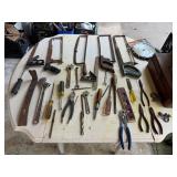 Multiple hammers, hacksaws, hand saws, metal
