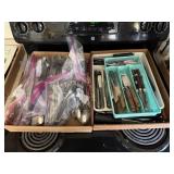 2 Boxes ful of silverware sets and silverware