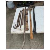Very large crow bar and 3- smaller ones, 2- axes,