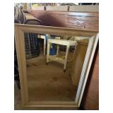 Vintage white desk on casters and white mirror,