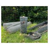 Several partial rolls of fence, chicken wire,