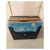 Black File Holder Filled with Variety of Record