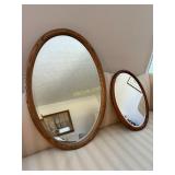 Two Oval Shaped Mirrors with a Bevel in Wooden