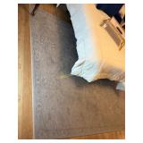 Area Rug with a Symmetric Design with Distressed