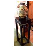 Lacquered oriental style stand with decorative