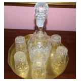 Cut glass decanter set with 5 glasses.