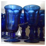 Footed goblets, glass pitchers, desert dishes and