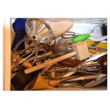 4 drawers of kitchen utensils.