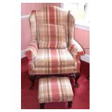 Upholstered wing back chair & ottoman.