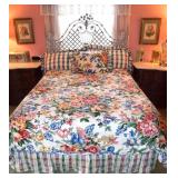 Queen size be with an ornate head board to