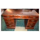 Knee hole desk with brass batwing pulls.