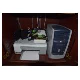 Dell monitor, computer tower, keyboard, printer,