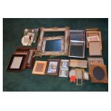 Various picture frames and framed pictures.