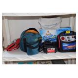 Shelf containing car buffer, jumper box, jumper