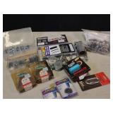 Assortments boxes, hose clamps, sickles, etc.