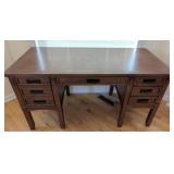 Wooden Desk with Multiple Drawers and Metal Handle