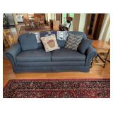Blue Upholstered Sofa and Turned Wood Side Table