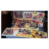 11 colorful reproduction copies of lobby cards
