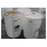 3 empty white barrels