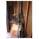 chain, pipe wrench and contents in corner