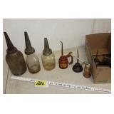 Vintage oil jars and cans