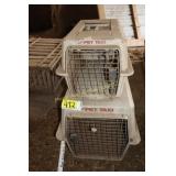 2 smaller pet carriers