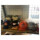 Various Nascar Related hats and a pile of older magazines Various Nascar Related hats and a pile of older magazines